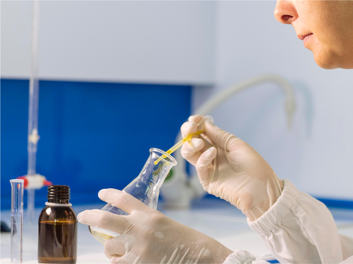 Certified Origins woman testing olive oil in lab